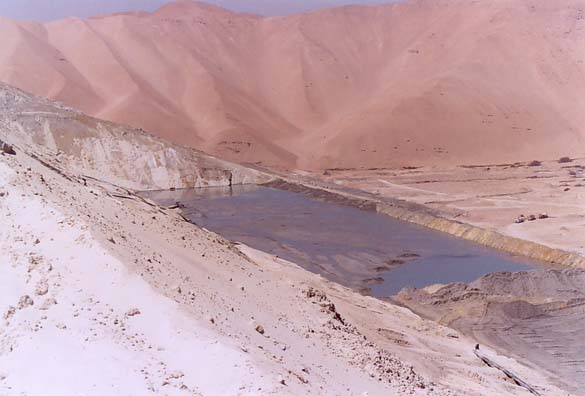 Downstream view at crest of Spoil Dam at Quebrada Honda, Moquegua, Peru. 