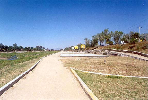 View of the Rio Atoyac looking upstream, showing the basketball courts.