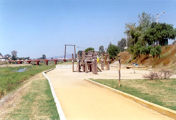 View of the left bank looking upstream, showing playground features. 