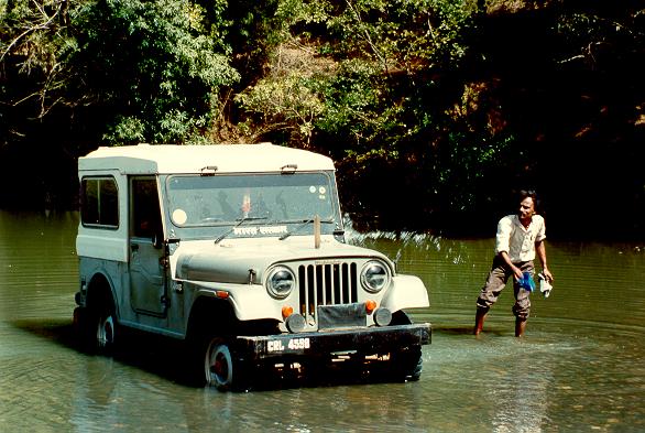 Mr. Srinivas, from NIH-Belgaum, 
washing jeep in Malaprabha river, Karnataka, India (January 1992).  
