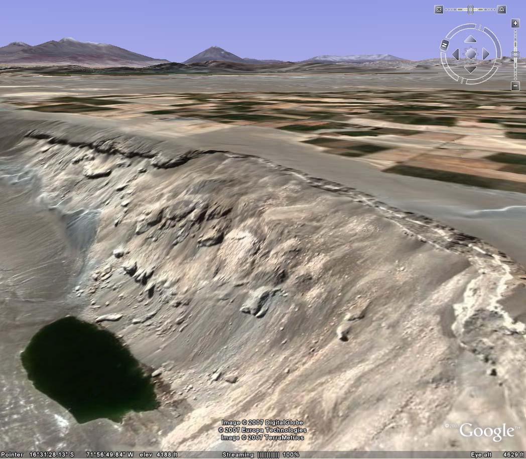 >Panoramic of La Cano slide zone, showing lagoon on bottom left and irrigated pampas on top right